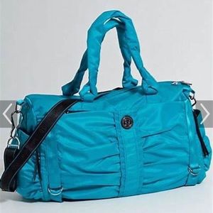 Lululemon duffel bag. Vintage! Teal color and barely used.